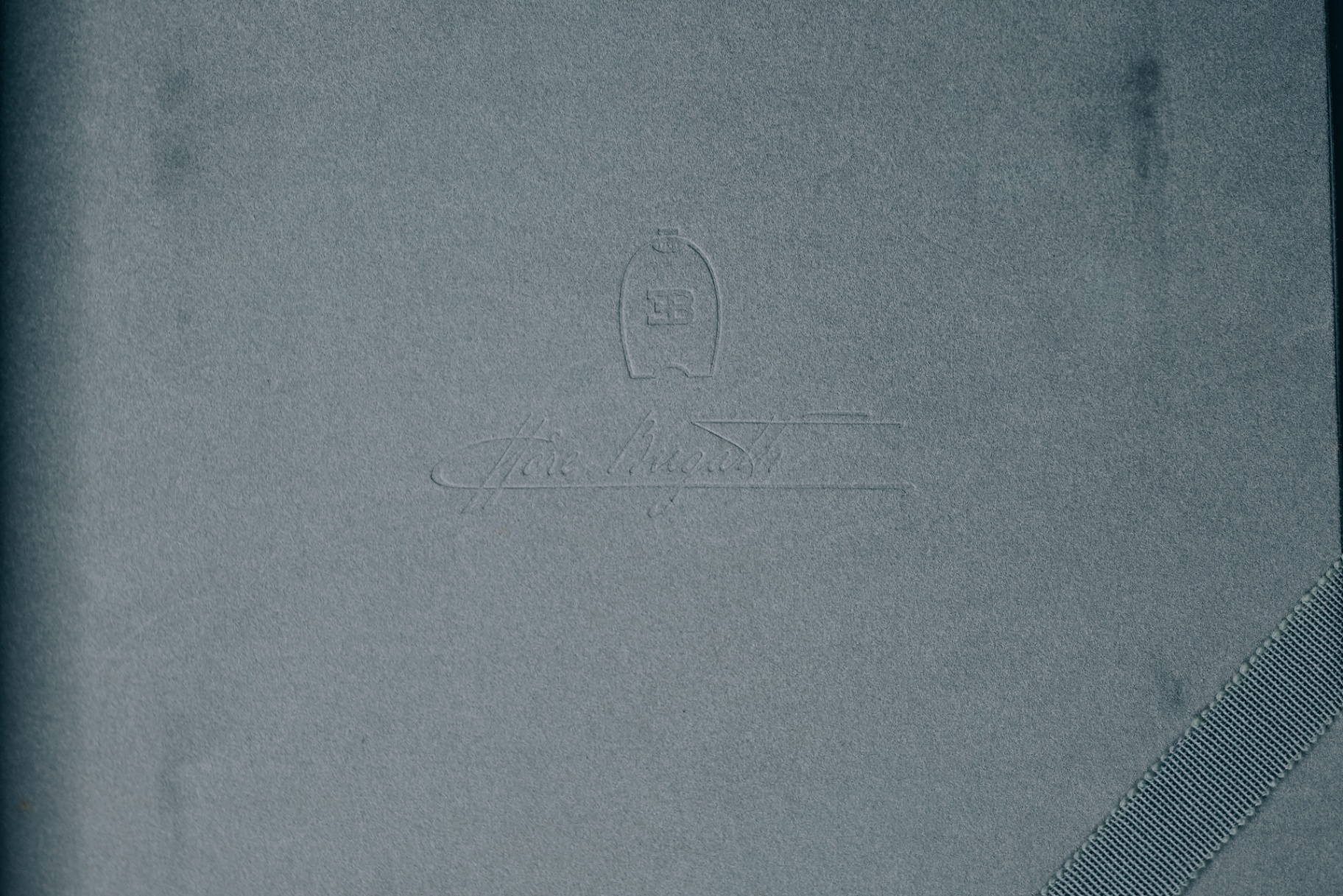 Embossed paper sleeve with EB crest