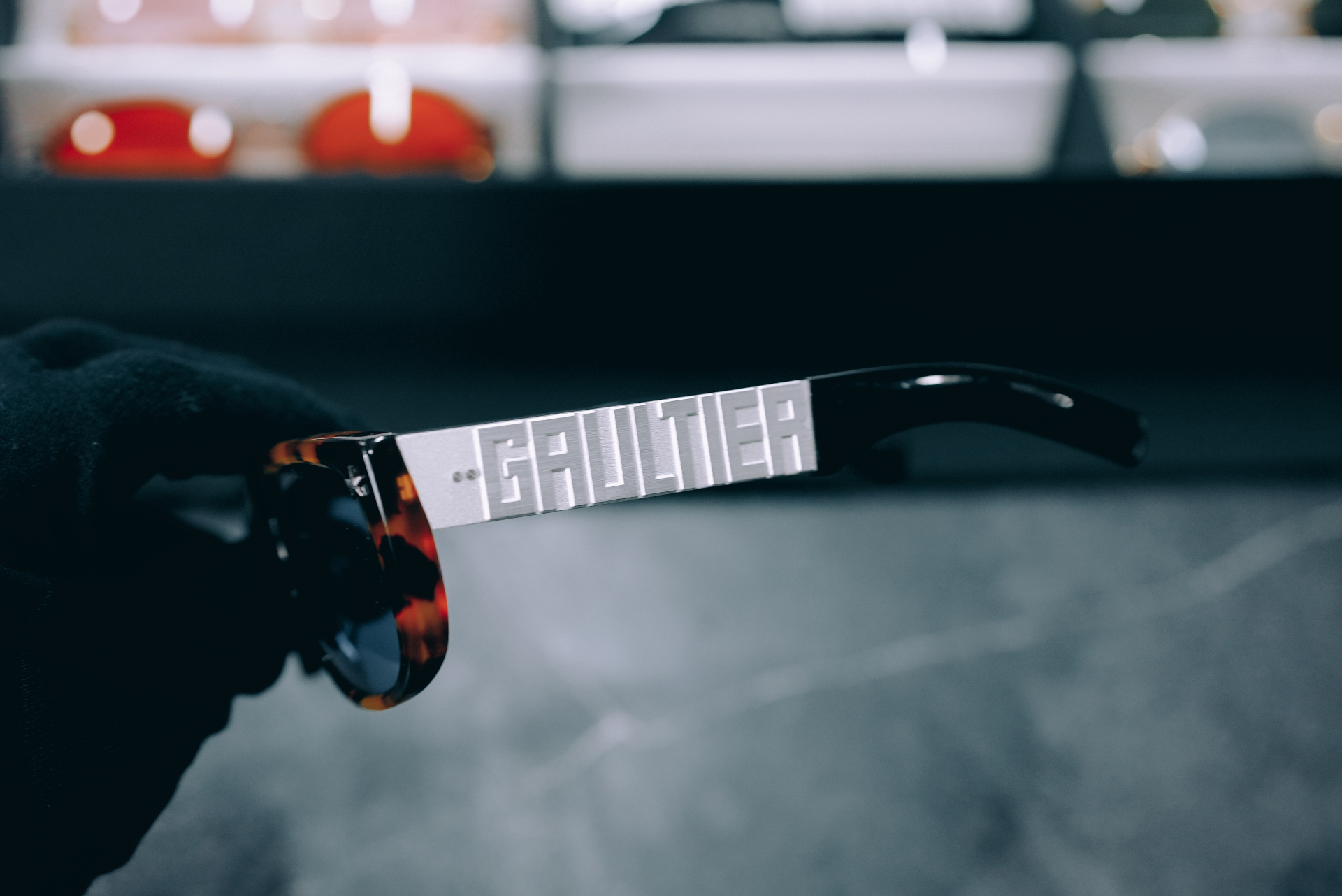 Side profile of tortoise Jean Paul Gaultier frame with sculpted GAULTIER temple plaque